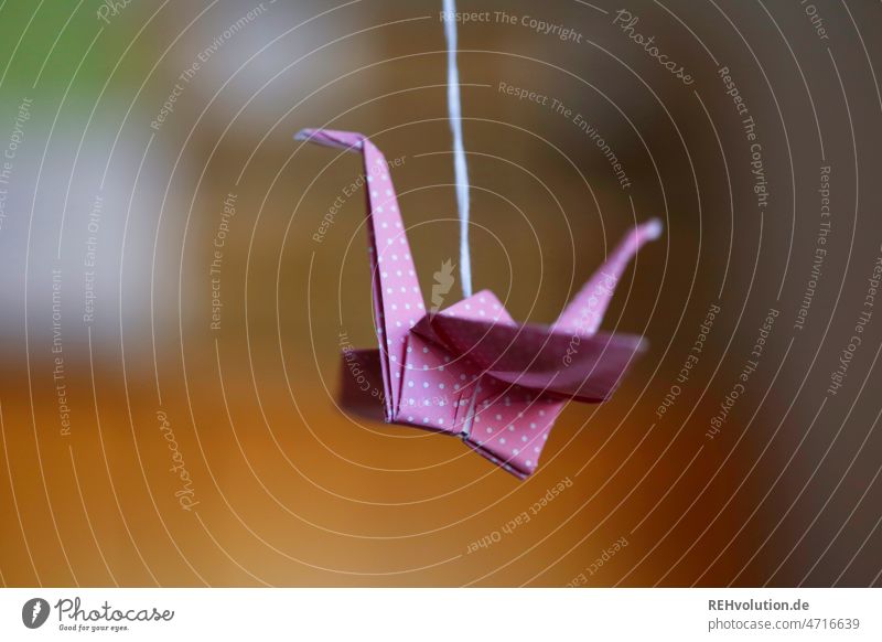 Origami Crane crease Origami Paper Flying Decoration Folded Pink background blur hobby Creativity creatively Art Interior shot Deserted Leisure and hobbies