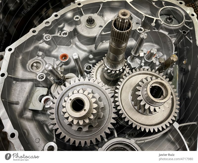 gearbox of an open engine with sprockets, shafts, gearwheels, transmission  of a combustion engine, car parts, mechanics - a Royalty Free Stock Photo  from Photocase