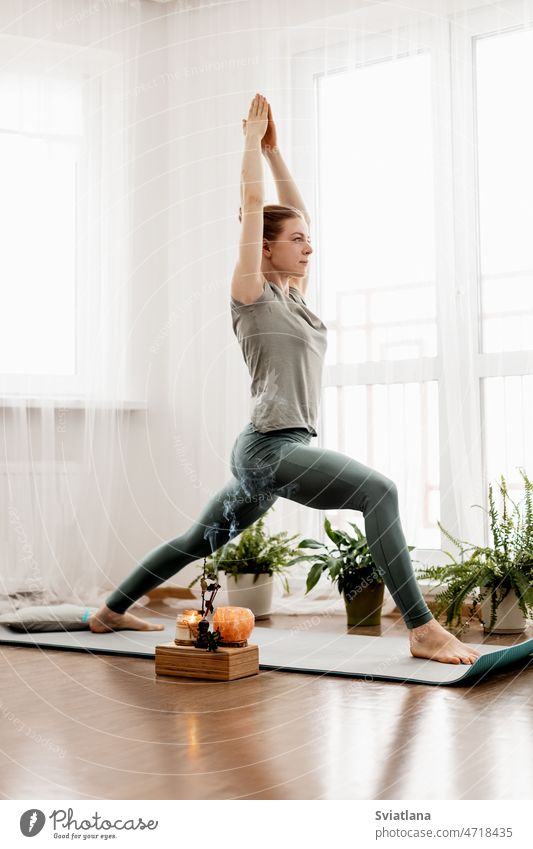Fit sporty active girl in fashion sportswear doing yoga fitness exercise in  front of gray wall, outdoor sports, urban style - a Royalty Free Stock  Photo from Photocase