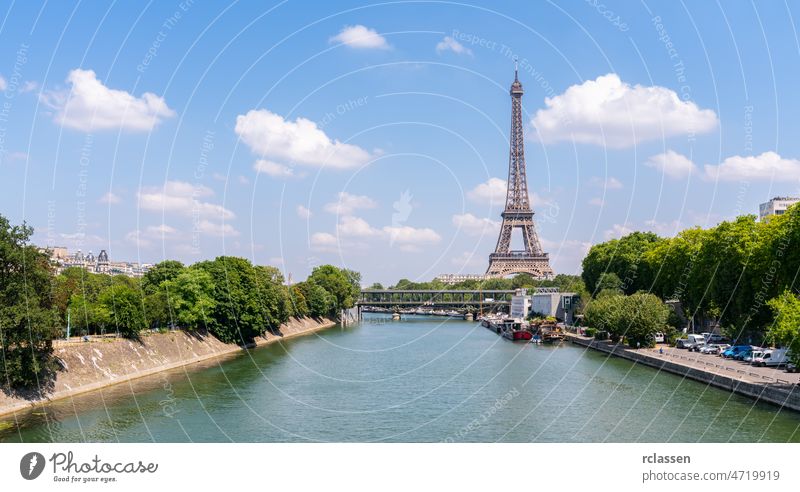 Paris Eiffel Tower and river Seine at summer in Paris, France. Eiffel Tower is one of the most iconic landmarks of Paris. paris eiffel tower france skyline