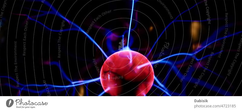 Plasma ball with energy rays on dark background plasma globe sphere technology glow electric science physics electricity laser atom magic orb purple light
