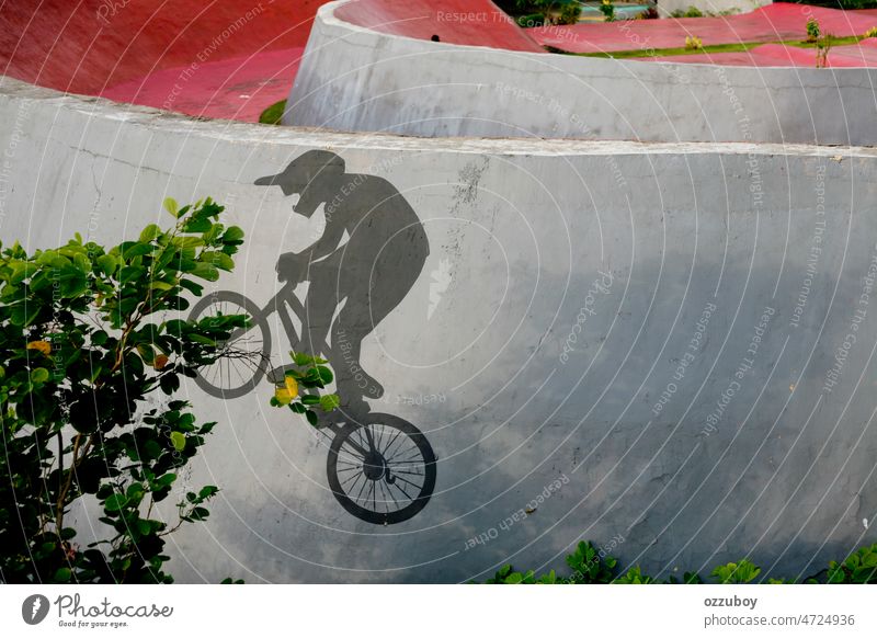 Black silhouette of a BMXer who is depicted with paints on the wall skatepark sport person outdoor action trick youth extreme balance active lifestyle boy male