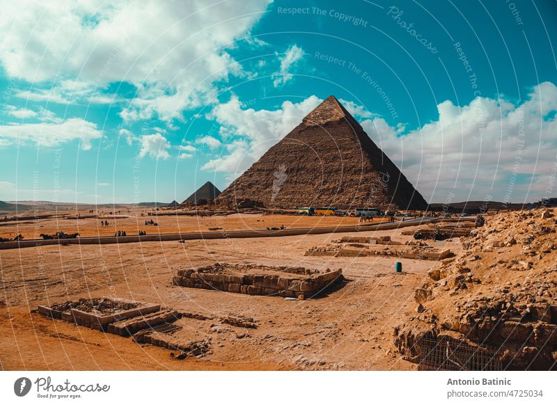 vacation, heat, cairo egypt, heritage, historical, ancient civilization, pyramids egypt, camel, archaeology, pyramids of giza, destination, pyramids, focus, blue, sky, travel, tourists, bus, 2022, vibrant, orange, teal, giza, pyramid, cairo, egypt, grea...