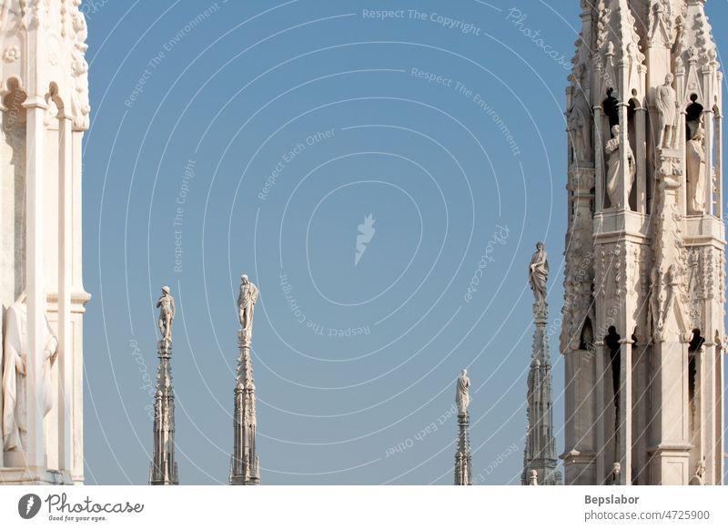 Statue on the spire Italy above architecture cathedral church commemorative faith high historic holiness holy isolated milano monument religion sculpt sculpture