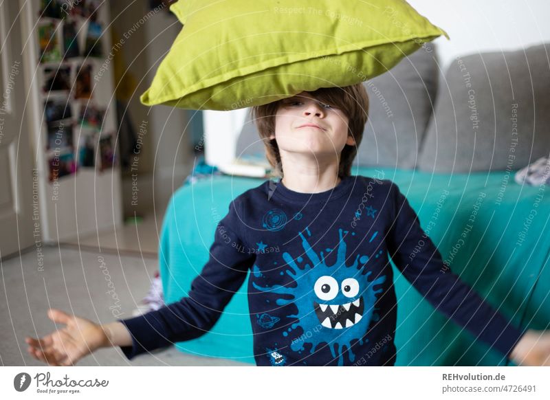 Child playing with a pillow Boy (child) portrait Infancy Authentic naturally Living room Flat (apartment) Joy Happiness Human being fun Joie de vivre (Vitality)