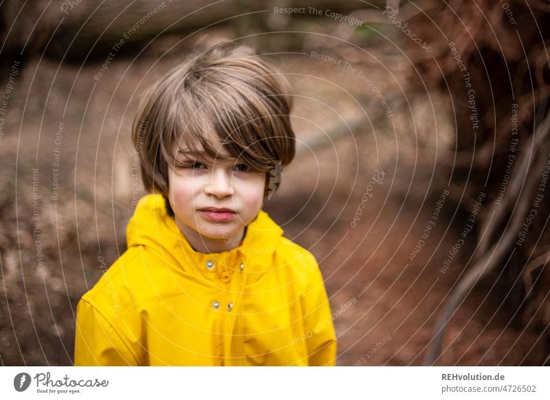 Child in the forest with rain jacket Day Environment Authentic Autumn Jacket Boy (child) Outdoors Forest Playing Nature Human being Infancy explore