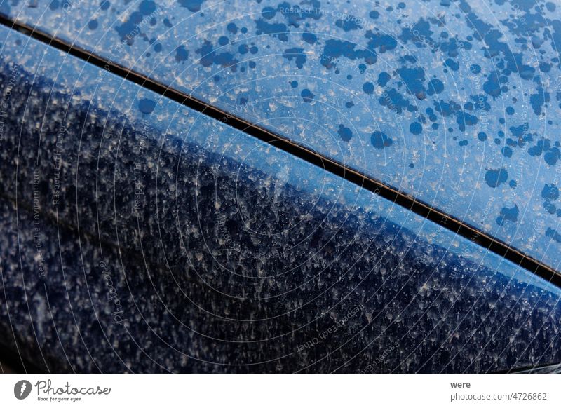 Fender of dark blue car with Sahara dust stains after rain Natural phenomenon Sahara wind Sand blood rain sandstorm spots