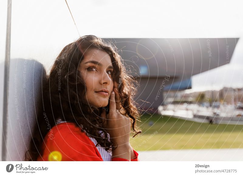 Closeup portrait of a cheerful young woman making a phone call outdoors in the city person lifestyle female happy mobile beautiful mobile phone communication