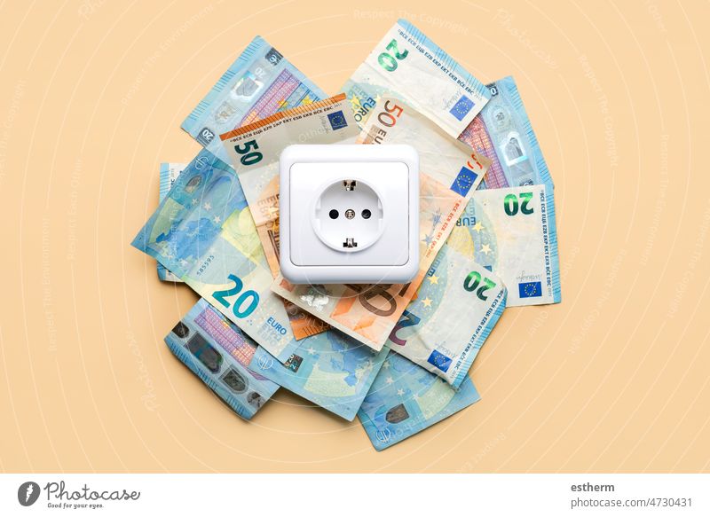 Electricity outlet socket with euro bills electricity outlet socket electric power energy economy crisis technology payments blackout consummation uptake sale