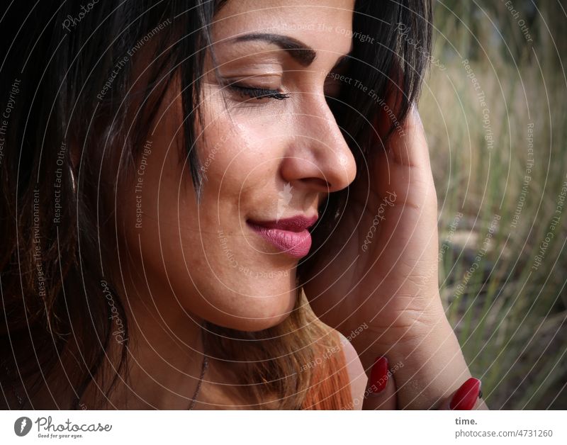 Woman enjoying the sun portrait Feminine Long-haired Dark-haired sunny Closed eyes To enjoy Hand stop Dream tranquillity Meditation Nature Meadow