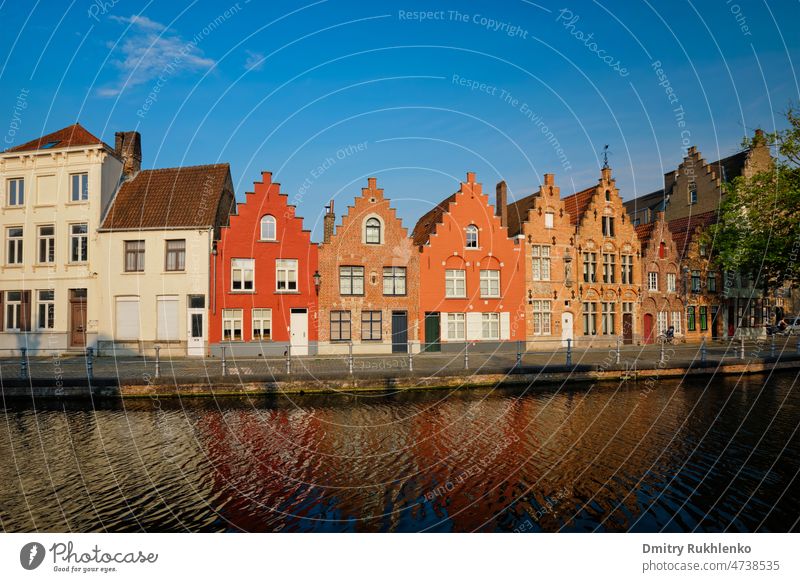 Typical Belgian cityscape Europe tourism concept - canal and old houses on sunset. Bruges (Brugge), Belgium Flanders town belgian medieval belgian houses