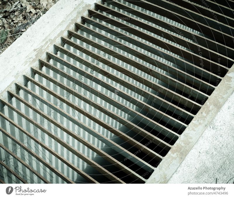 Close up view of manhole mesh. monochrome industrial texture industry background grate grille metallic backdrop black floor city system old sewage drainage