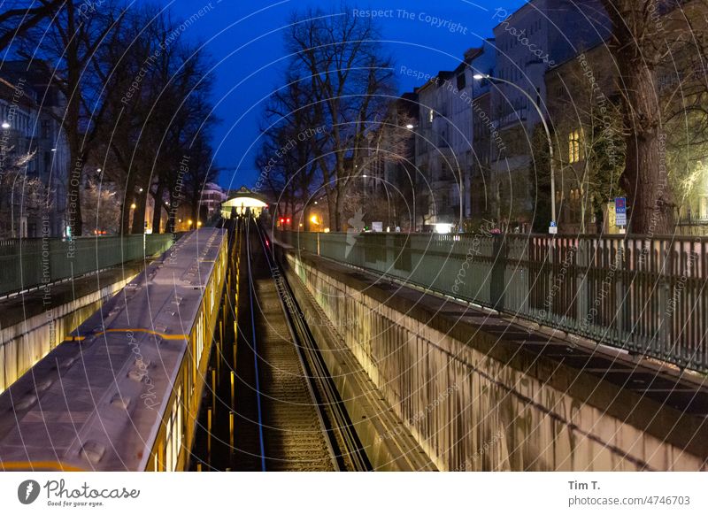 Subway train moves from the tunnel to the surface Berlin Prenzlauer Berg Night Town Exterior shot Downtown Capital city Deserted Colour photo Architecture