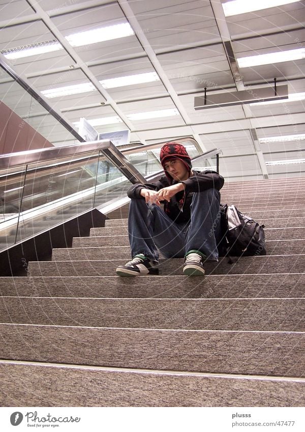 In the Thought2 Style Human being Man Adults Youth (Young adults) Airport Stairs Escalator Cap Sit Dream Wait Loneliness Solitary Empty Baseball cap Go under