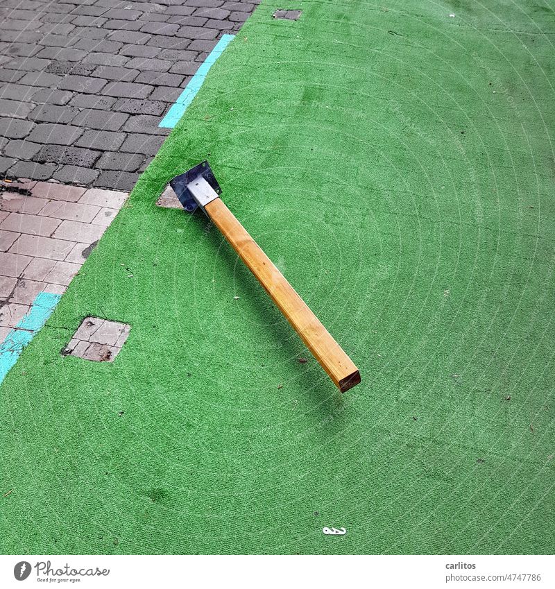 Knockout| wooden post lies on the ground Street pavement Artificial lawn cordon Barrier posts Vandalism Parking lot Lie wooden posts mark Road traffic Safety