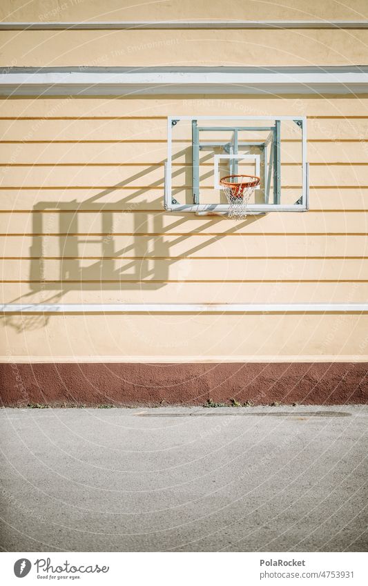 #A0# Basketball hoop on yellow wall Basketball basket Basketball arena basketball net basketball court Wall (building) Sports Exterior shot Playing Ball sports