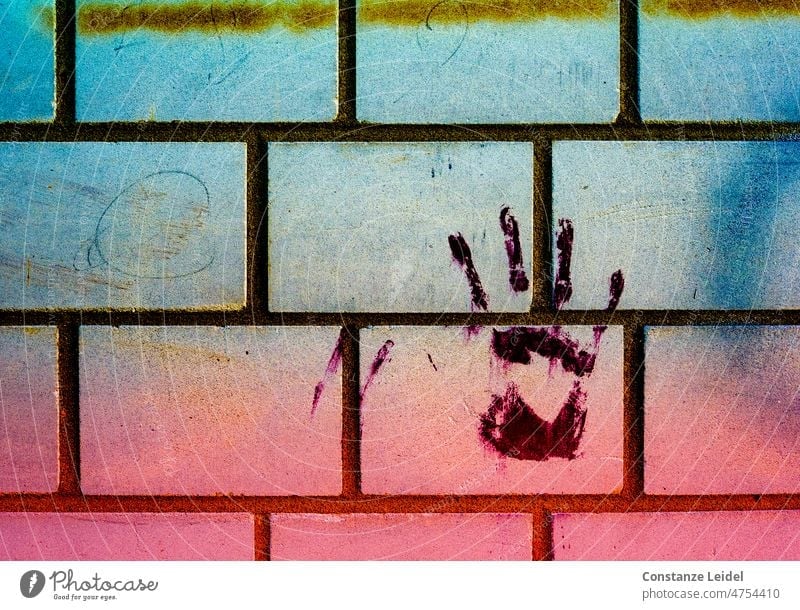 Hand print with paint on brick wall handprint Fingers house wall Graffiti Blue Pink Stone wall Imprint Multicoloured Wall (building) Fingerprint Creativity