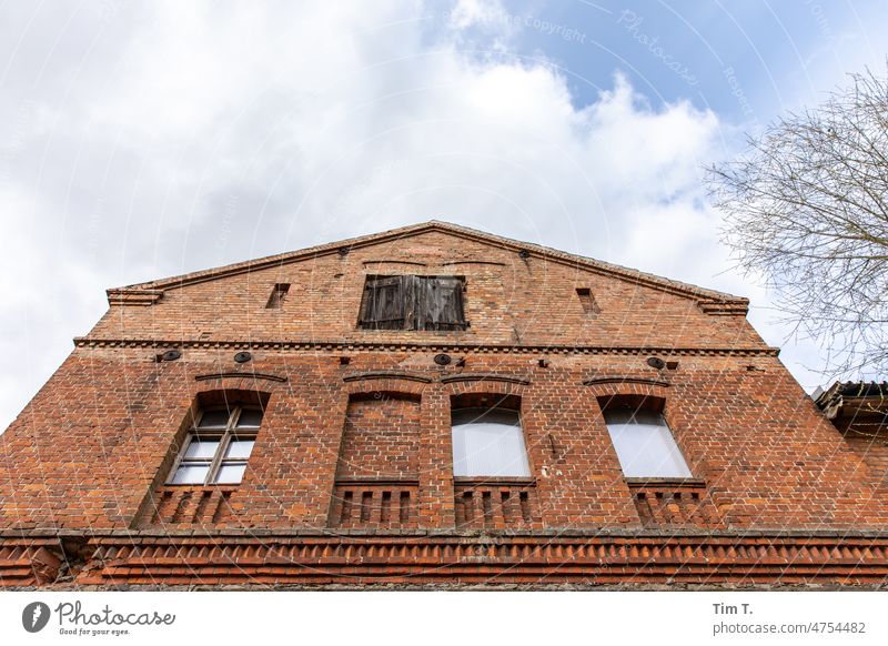 an old rural farm building Brandenburg Estate Day Deserted Exterior shot Colour photo Sky Clouds Copy Space top Building clinker clinker facade farm buildings