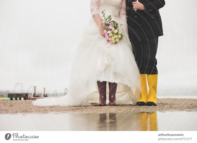 Wedding couple in rubber boots on rainy wedding day at lake Love Colour photo Bride Matrimony Feasts & Celebrations Wedding dress Bride groom Couple
