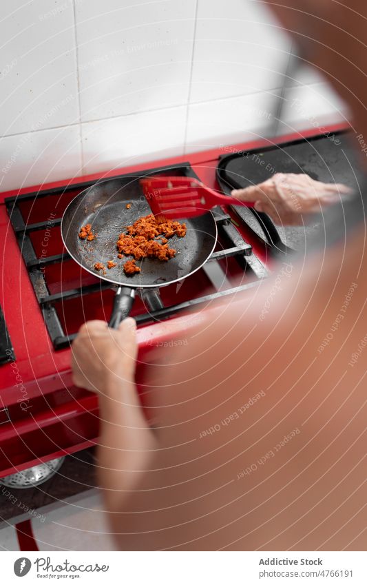 Unrecognizable person frying food on stove Mexican food cook minced meat dish culinary cuisine mexican frying pan kitchen ingredient fried delicious tasty yummy