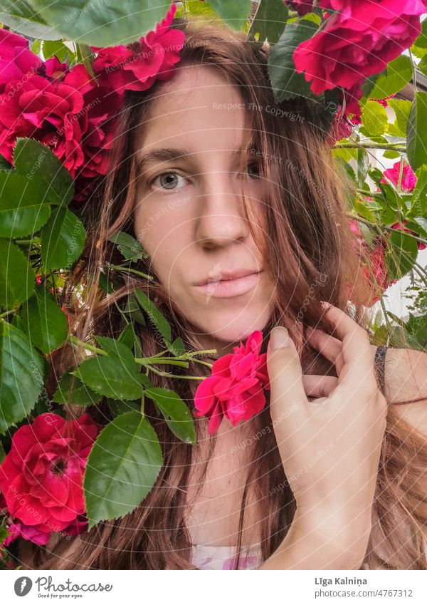 Portrait of woman between roses Woman Young woman Human being Face Portrait photograph Youth (Young adults) Beautiful Feminine Adults Face of a woman 1 portrait