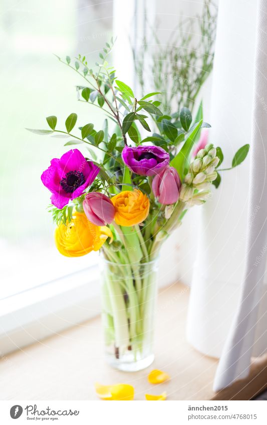 A colorful spring bouquet stands on a windowsill Window Decoration flowers Bouquet Spring Joy silent Blossom variegated cheerful Interior shot Colour photo