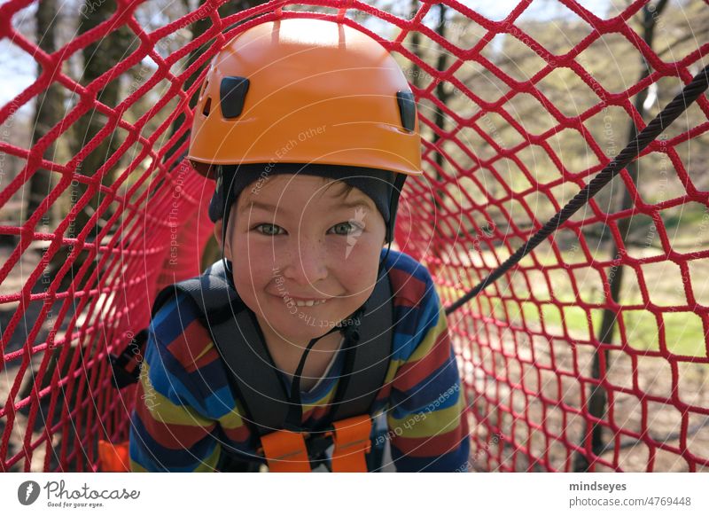 Naughty boy climbing Boy (child) Climbing Helmet Network Tunnel Infancy out Adventure Joy Brash Exterior shot Child Nature Movement 3 - 8 years Lifestyle