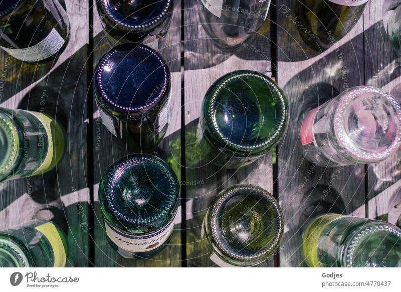 Wine bottles stuck upside down in wood Vine Bottle Alcoholic drinks Bottle of wine Colour photo Beverage Glass Red wine Drinking Deserted Close-up Winery Detail