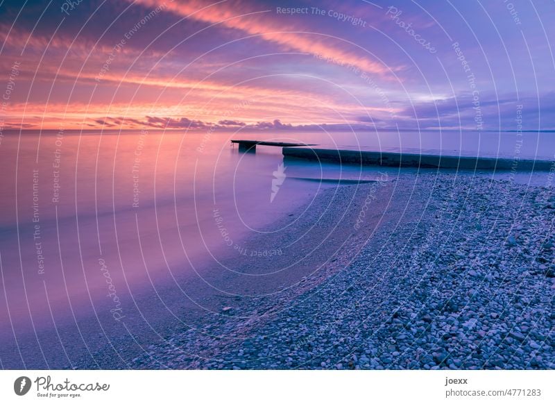 Sky, sea, jetty and colors Beach Ocean Footbridge coast Landscape Vacation & Travel Nature Water Exterior shot Long exposure Evening Sunset Clouds purple Orange