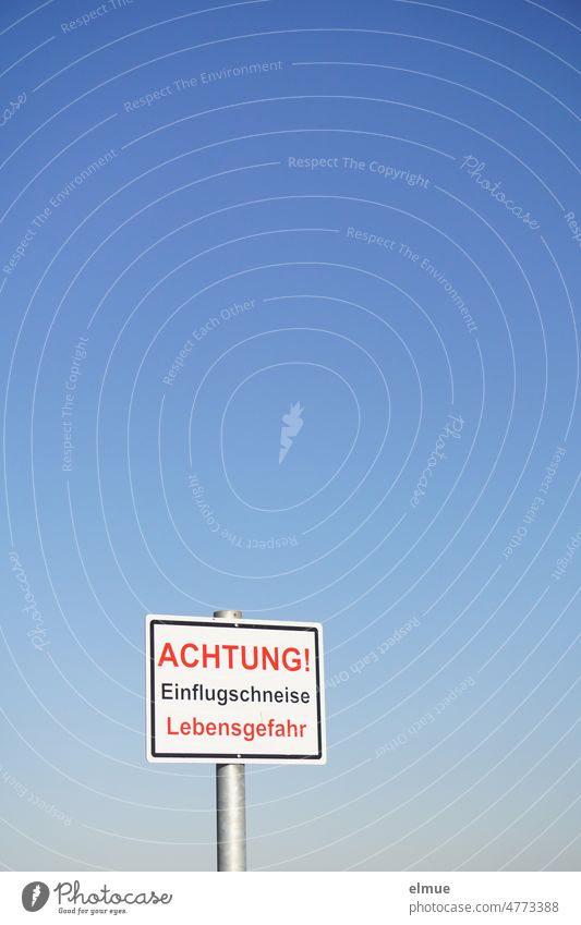 Sign with the inscription - ATTENTION! approach lane danger to life - in front of blue sky / air traffic. sign esteem Flight path Danger of Life Clue Signage
