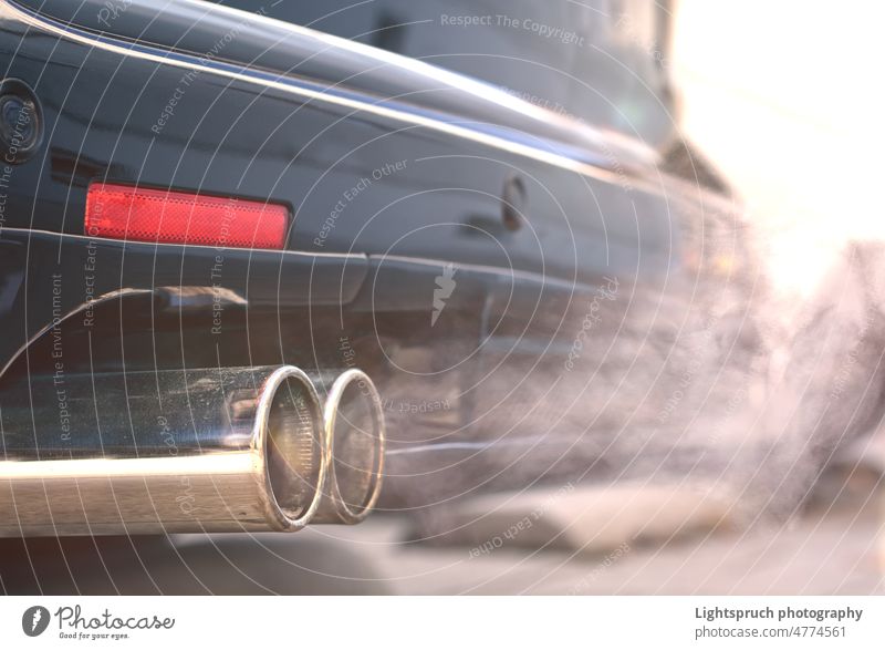 Close up of smoky dual exhaust pipes from a starting diesel car. dirty smoke - physical structure volkswagen emissions scandal auto transportation vehicle