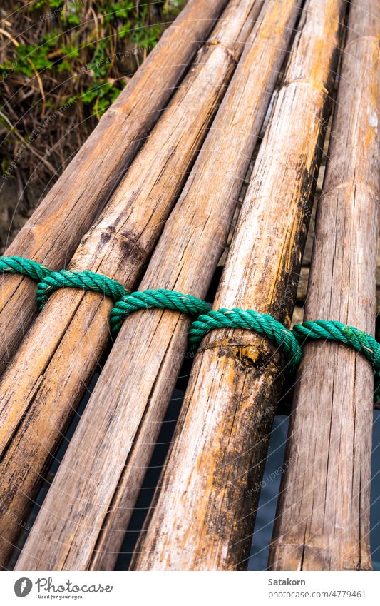 Dried bamboo tie with green nylon rope - a Royalty Free Stock Photo from  Photocase