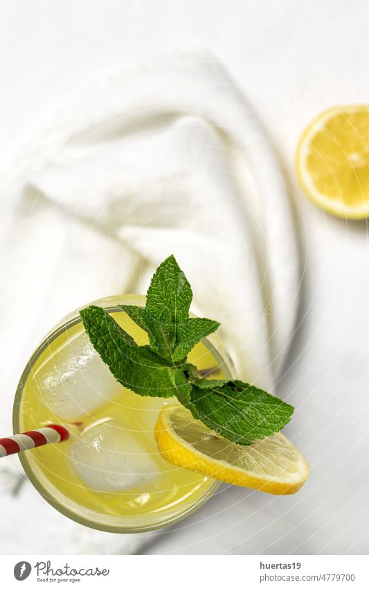 Fresh Lemonade or mojito cocktail with lemon, mint and ice beverage lime lemonade white background drink Mojito cold glass fresh water healthy yellow cool