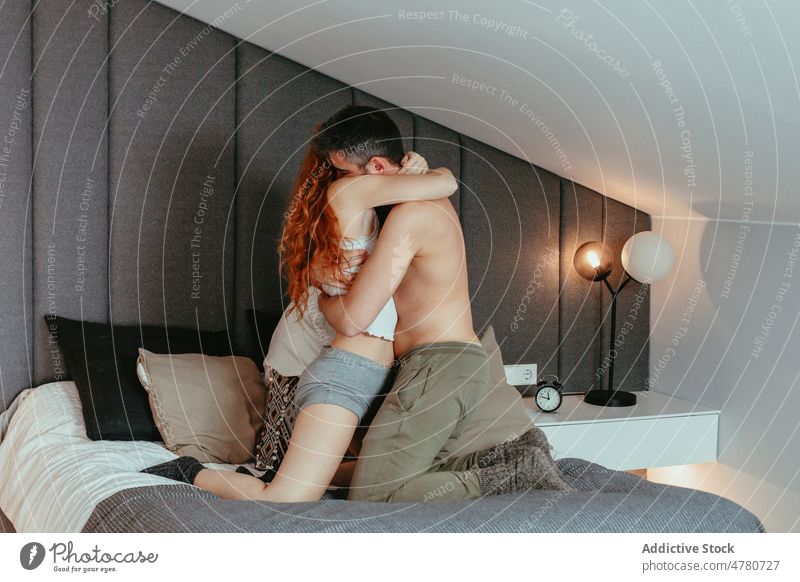 Loving couple hugging on bed bedroom love bonding cuddle romantic affection caress fondness embrace together home spend time boyfriend girlfriend apartment