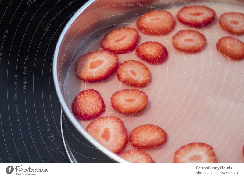 Strawberries on top of a pink cheesecake strawberry food homemade baking fruit snack healthy fresh natural organic sweet tomato plate salad appetizer breakfast