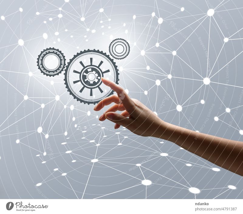 Woman's hand on a gray background with line connections and dots. Business process management and workflow automation diagram with gear arm business cog
