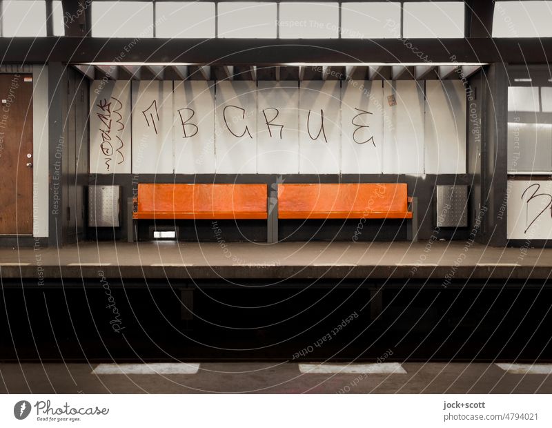 Everything can wait, except life - even on the platform Station Architecture Train station Kreuzberg Berlin Shadow Platform Bench Empty Deserted Orange