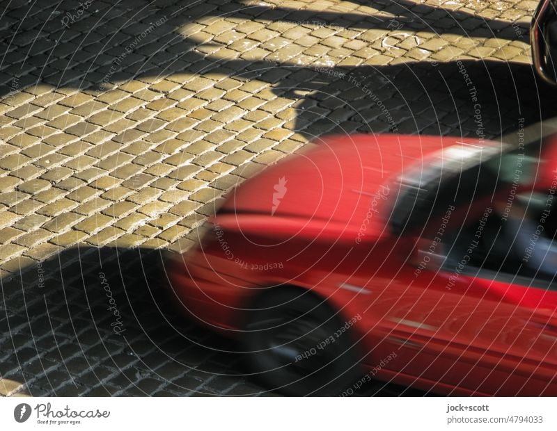 Cart rattles as he drives over cobblestones car Cobblestones Driving Traffic infrastructure motion blur Means of transport Mobility Speed Bird's-eye view