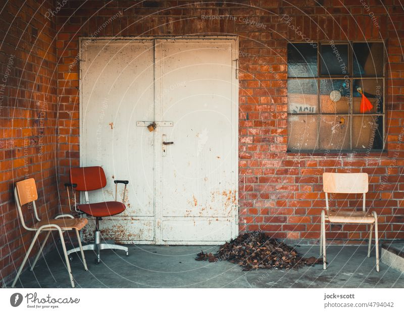 waiting chairs next to pile of leaves Chair Seating Places Break Window Metal door Deserted Free clinker Window transom and mullion heap of leaves playground