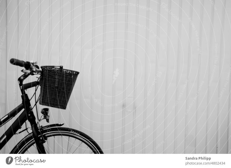 Partial view bicycle in front of a white wall Bicycle minimalism negative space Minimalistic Structures and shapes Abstract Wall (building) Line Facade Modern