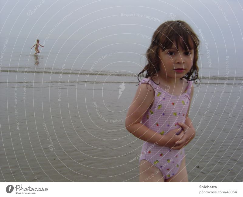 Joy in the background Child Ocean Beach Girl Freeze Hop