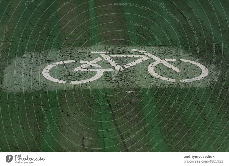bicycle sign on a special green bicycle lane for biking. High quality photo bike road city cyclist background outdoor path ride route sport street symbol track