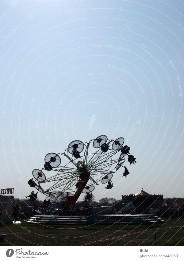 now it's going round and round Fairs & Carnivals Back-light Village fair carousel Markets Sky Joy