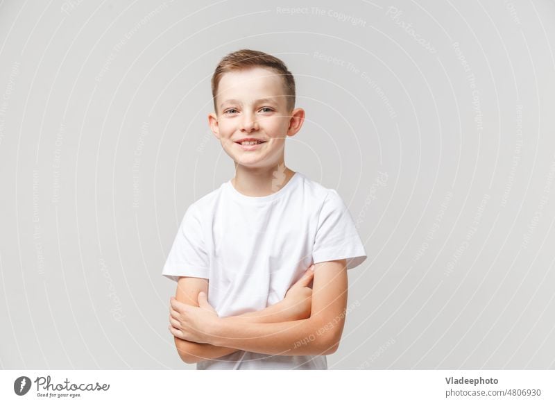 Smiling boy on a light gray background child portrait smile cute face childhood male person cheerful fun happiness one smiling happy beautiful little youth