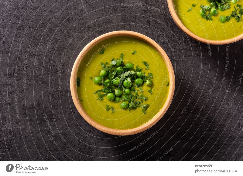 Green pea soup black bowl cooking cream creamy diet dinner food green healthy herbs meal nutrition slate vegan vegetarian veggie wood