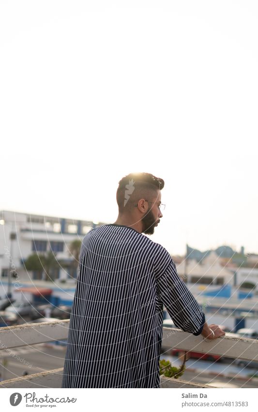 Handsome young bearded man under the sunset handsome handsome man handsome good-looking handsome young man handsome guy handsome people Peoples photogenic