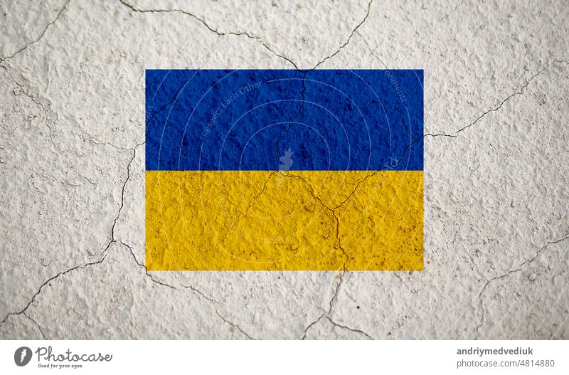 An old image of the flag of Ukraine on a wall with a crack. A crisis. Pray for Ukraine. Safe Ukraine ukraine patriotic national grunge divide disagreement dirty