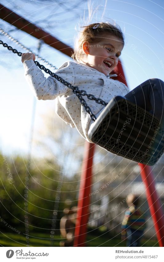 Girl swings Infancy Joie de vivre (Vitality) Happy Authentic Playing naturally Movement Swing Playground To swing Child Human being Leisure and hobbies elan