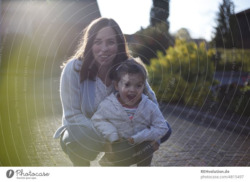 Mother with her daughter against the light Daughter Laughter Smiling Joy Happy Family & Relations 5 years old happy child Infancy fortunate glad