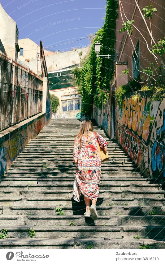 Woman in colorful dress on a dilapidated staircase in Cagliari Stairs Dress variegated Go up ascent stagger staircases stair treads Tumbledown Old Upward